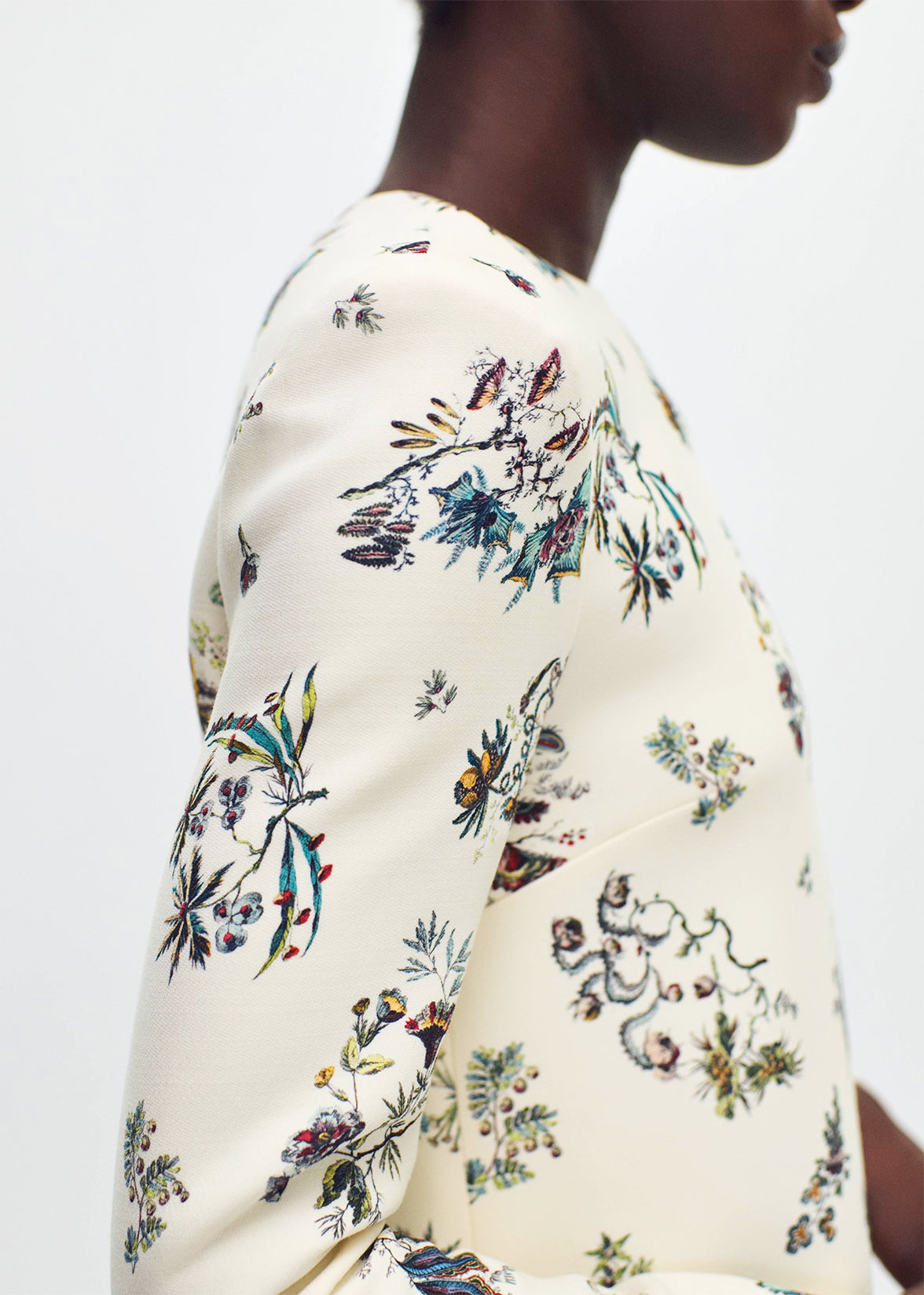 close up of model wearing  the tilley dress in printed silk wool ivory floral