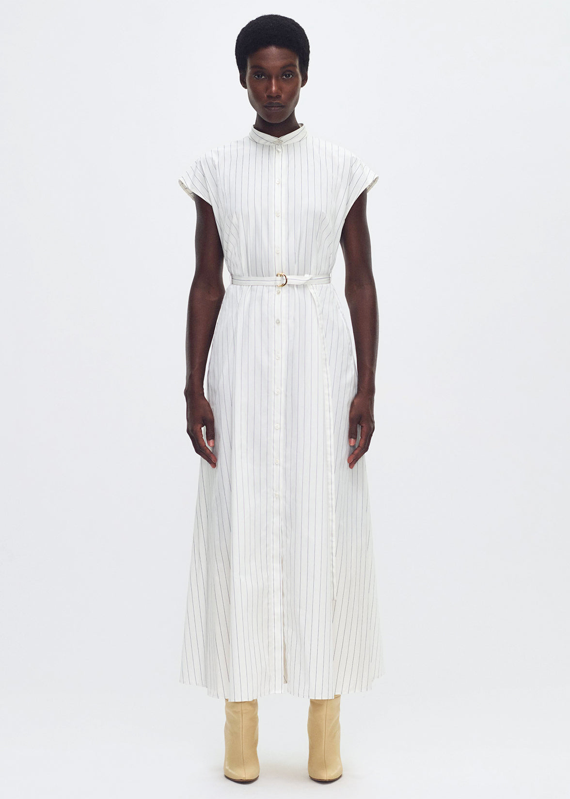 model wearing the DEJEUNER DRESS IN STRIPE POPLIN in pale white