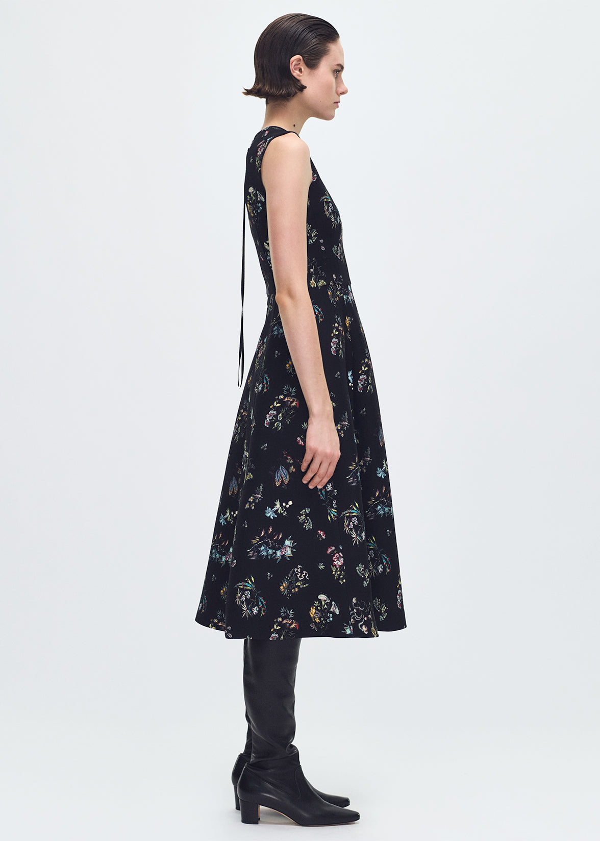 side profile of model wearing the Eloise Dress In Printed Silk Wool in Black Floral