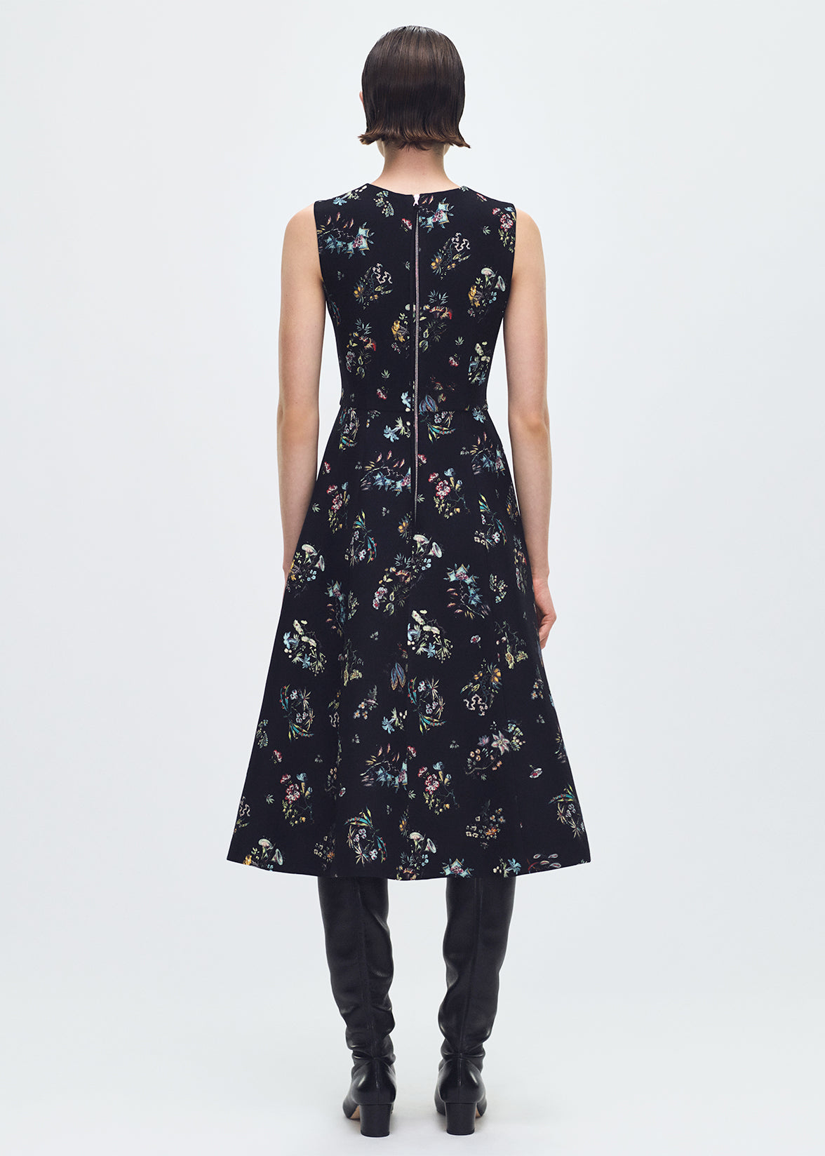 back profile of model wearing the Eloise Dress In Printed Silk Wool in Black Floral