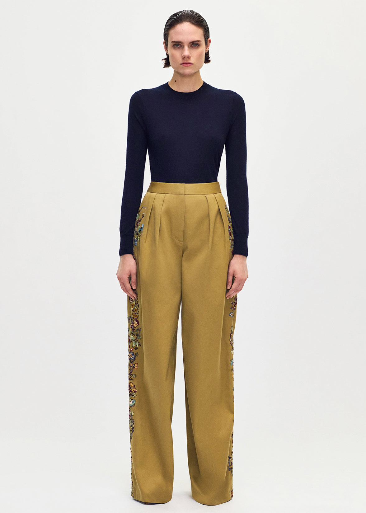 front profile of model wearing the Nils Pant in Embroidered Cotton Twill