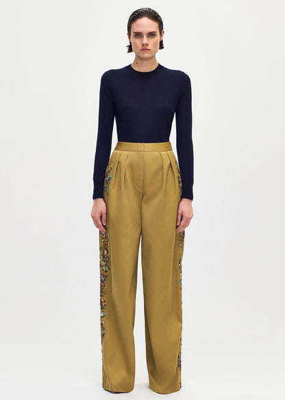 front profile of model wearing the Nils Pant in Embroidered Cotton Twill