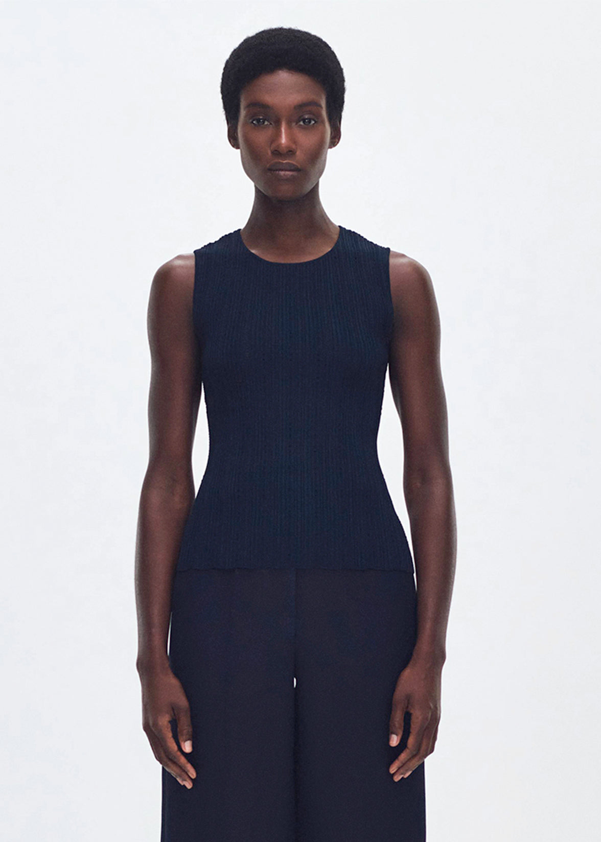 front profile of model wearing the brynn top in compact jacquard in navy