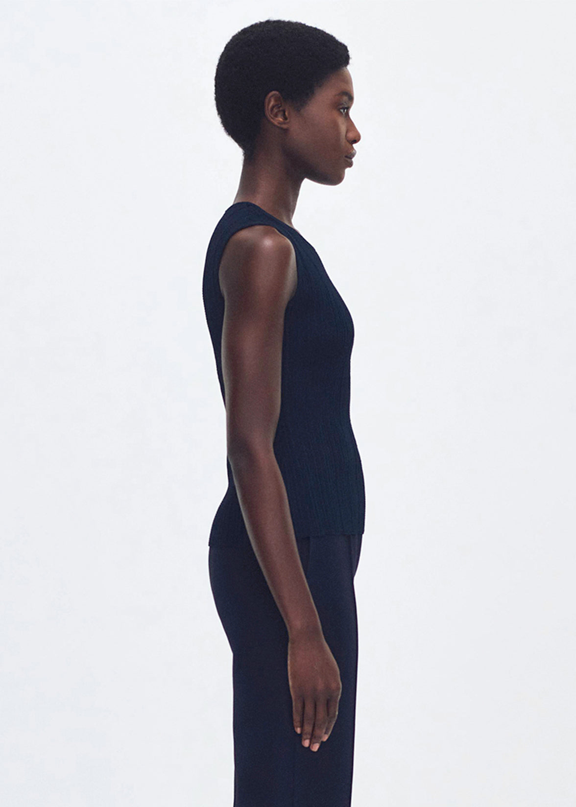 side profile of model wearing the brynn top in compact jacquard in navy