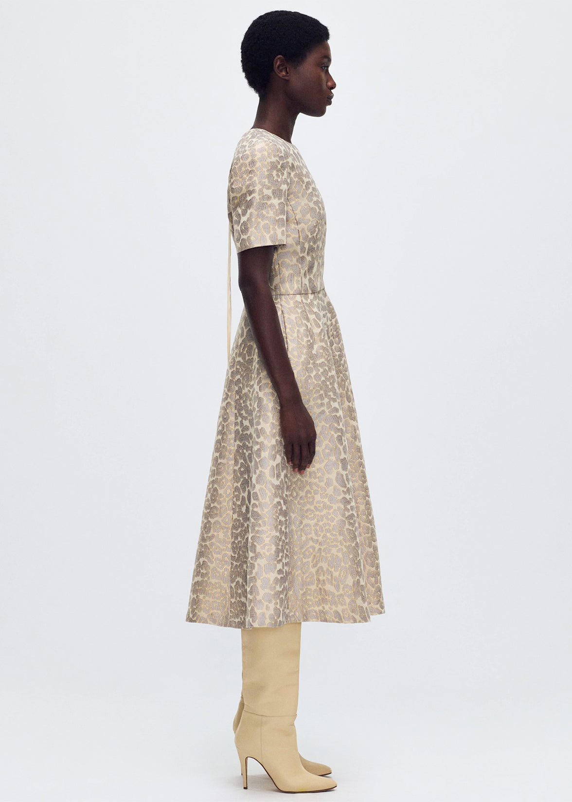 side profile of model wearing the Evangeline Dress in Leopard Jacquard