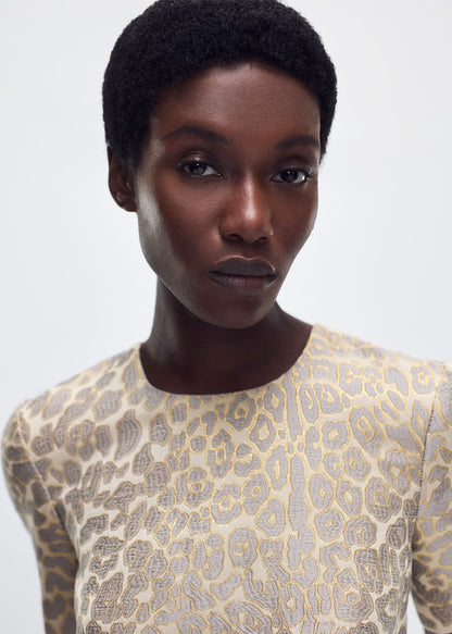 close up of model wearing the Evangeline Dress in Leopard Jacquard