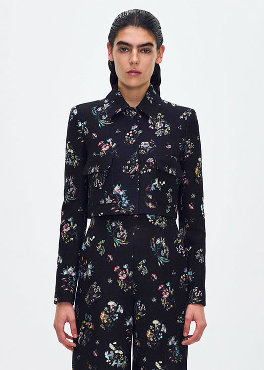 front profile of model wearing the cecil jacket in printed silk wool in black