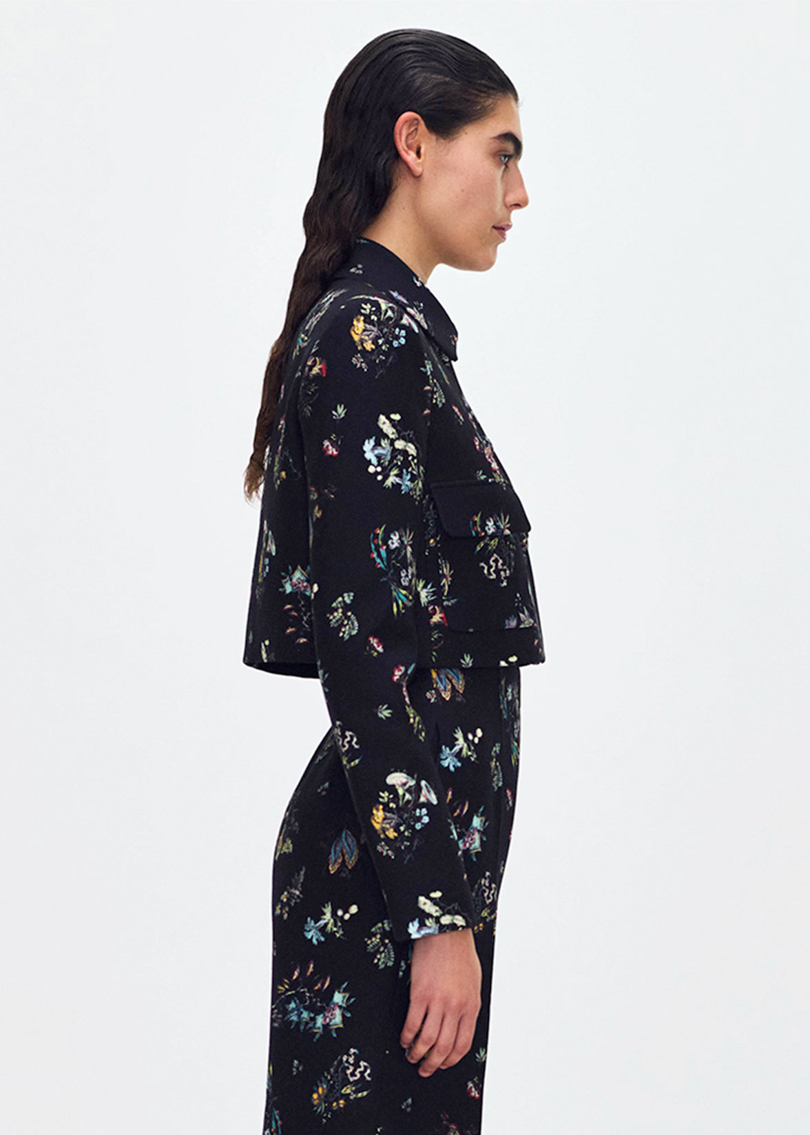 side profile of model wearing the cecil jacket in printed silk wool in black