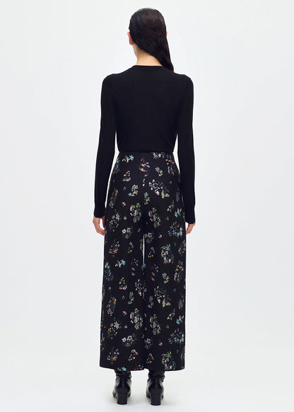 back profile of model wearing the Callen Pant in Black Floral