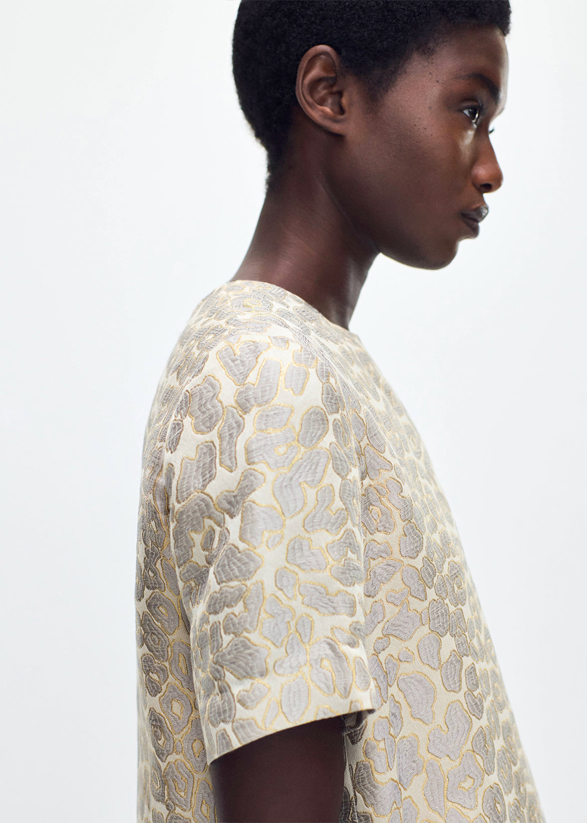 close up of model wearing the Pleat Back Top in Leopard Jacquard