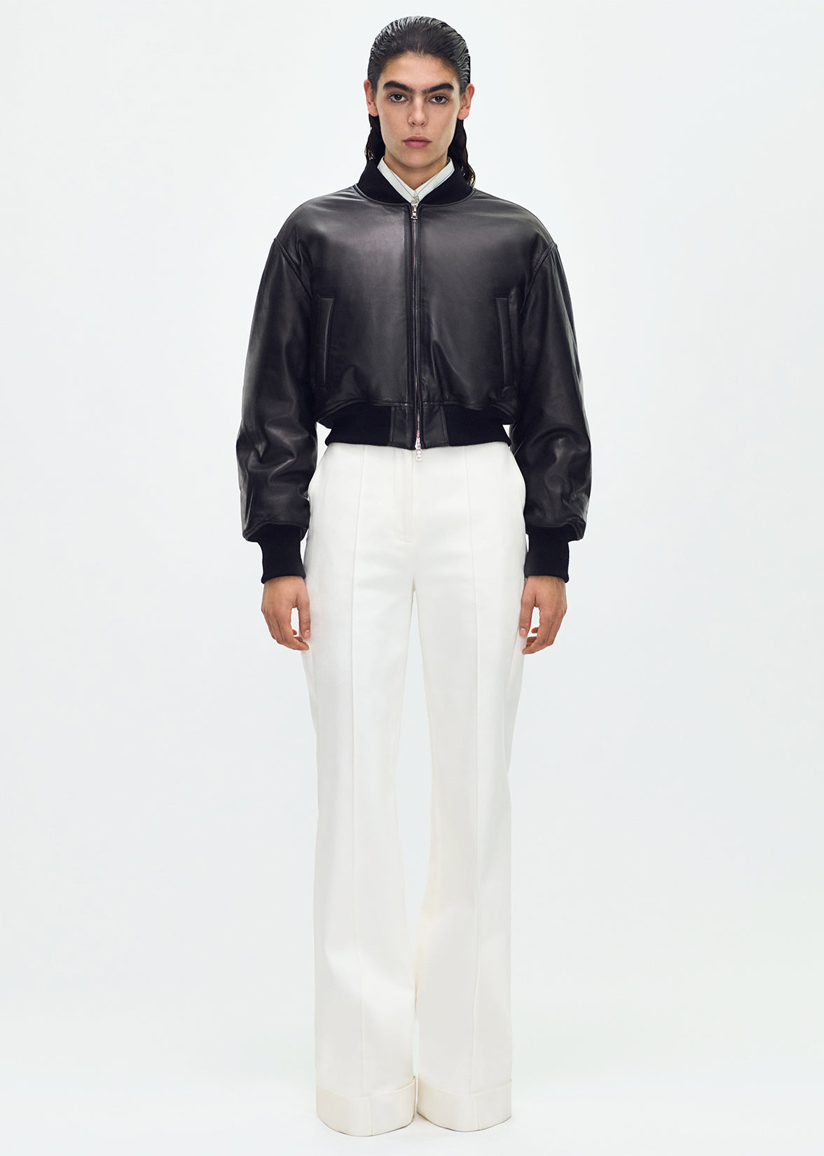 front full body profile of model wearing the Bomber Jacket in Black Leather