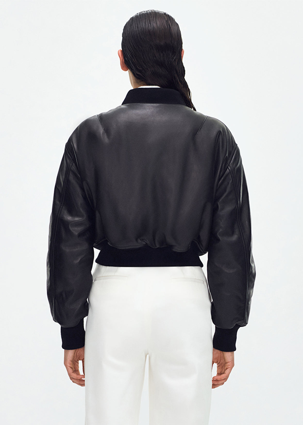 back profile of model wearing the Bomber Jacket in Black Leather