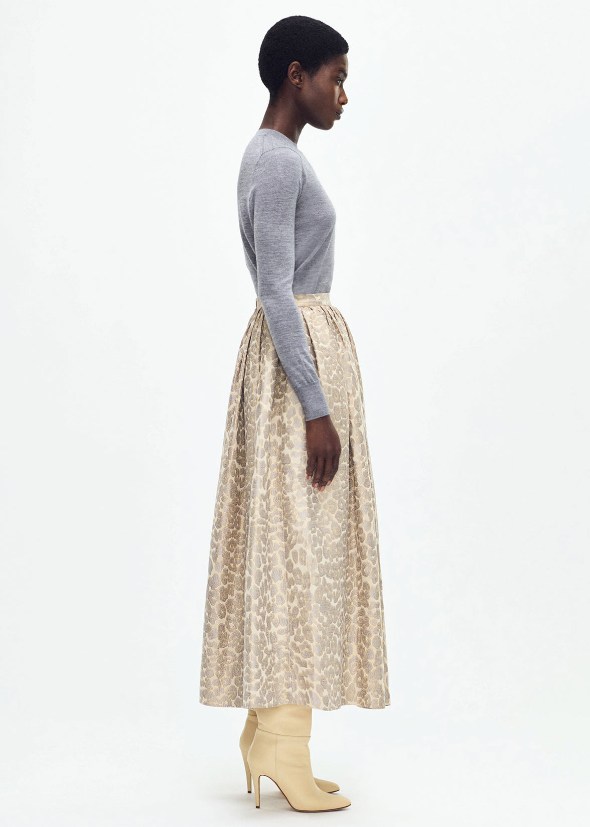 side profile of model wearing the cosmina skirt in leopard jacquard