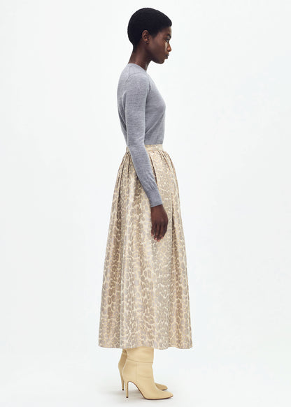 side profile of model wearing the cosmina skirt in leopard jacquard