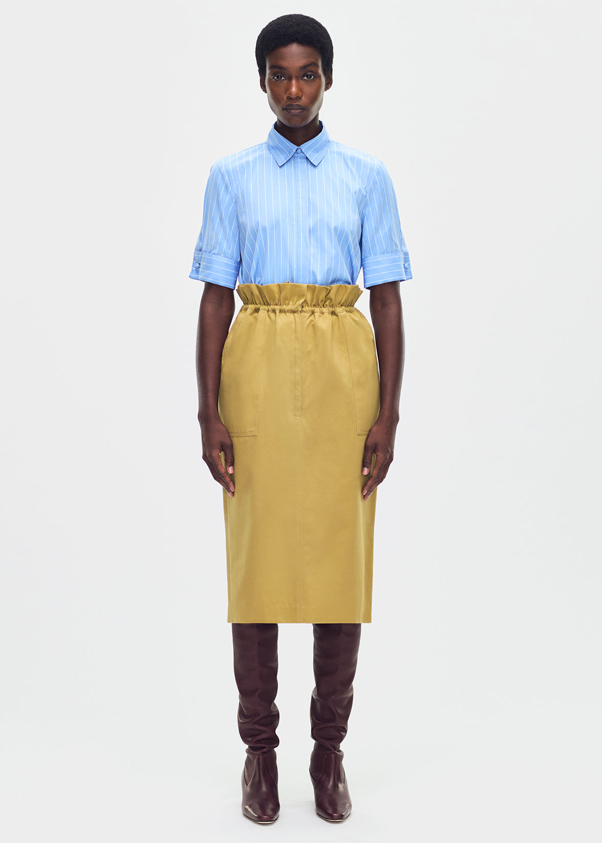 model wearing the sullivan skirt in lightweight cotton twill khaki