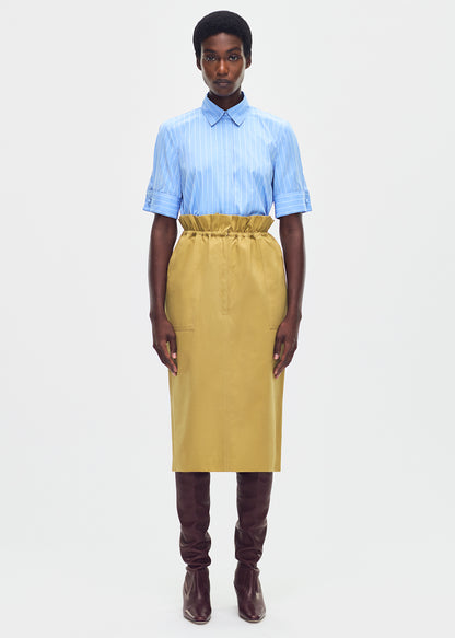 model wearing the sullivan skirt in lightweight cotton twill khaki