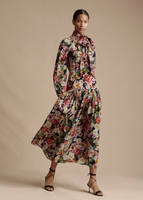 A model walking while wearing the Sigrid Dress in Printed Crepe de Chine. 