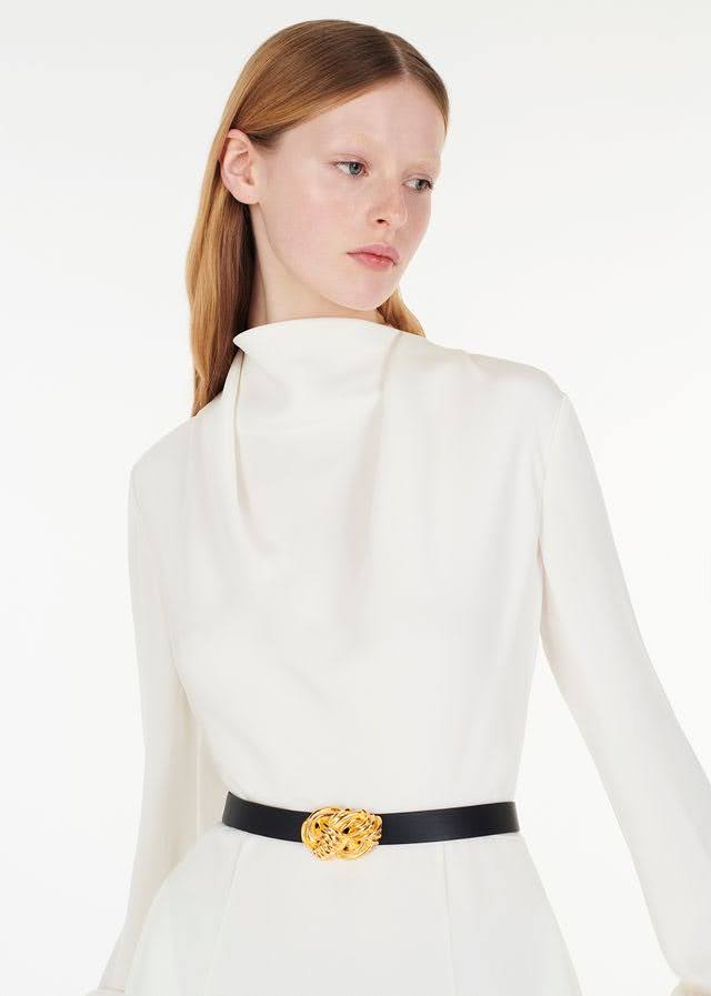 model wearing the gold knot buckle belt with blythe dress in ivory