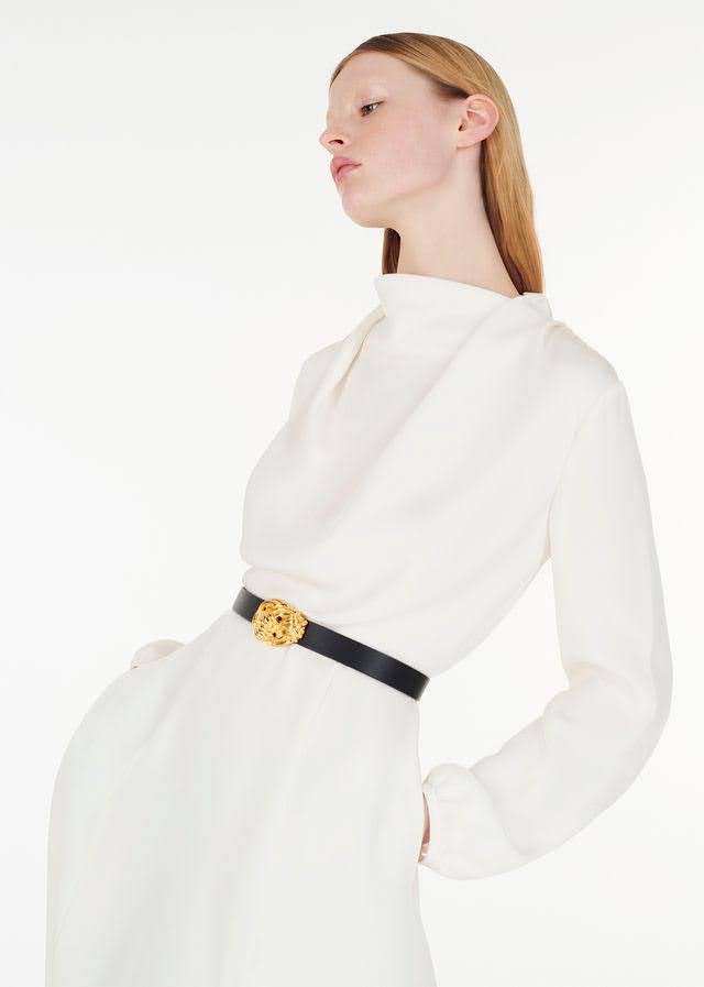 model wearing the gold knot buckle belt with blythe dress in ivory by Adam Lippes