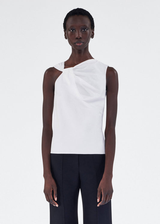 model wearing feyda top by adam lippes in compact cotton poplin in white