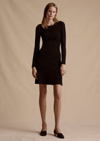 Model is wearing the Pointelle Knit Short Dress in Black. The Dress hits mid-thigh and has long sleeves.