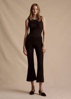 Model is wearing the Cropped Pant in Black Pointelle Knit with the matching Black Shell Top.