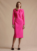 Model is wearing the long sleeve, midi-length hot pink Minton Dress in Light Weight Wool Crepe.