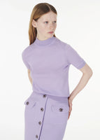 Model wearing the Mockneck Top in Ultra-Fine Cashmere Lavender with the Dakota Skirt in Wool Crepe in Lavender