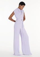 Side Profile shot of model wearing the Blythe Jumpsuit in Silk Crepe in Lavender.
