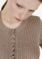 Close up of Full shot of model wearing the Parker Henley in Cashmere Silk Rib Knit in Mink.