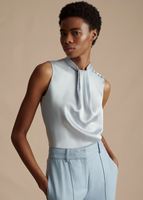 Model wearing the Draped Neck Shell in Silk Charmeuse in Pale Blue with the Trousers in Stretch Canvas in Pale Blue.