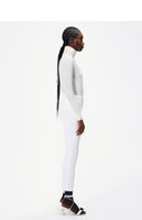 model wearing the cigarette pant in white in stretch cady