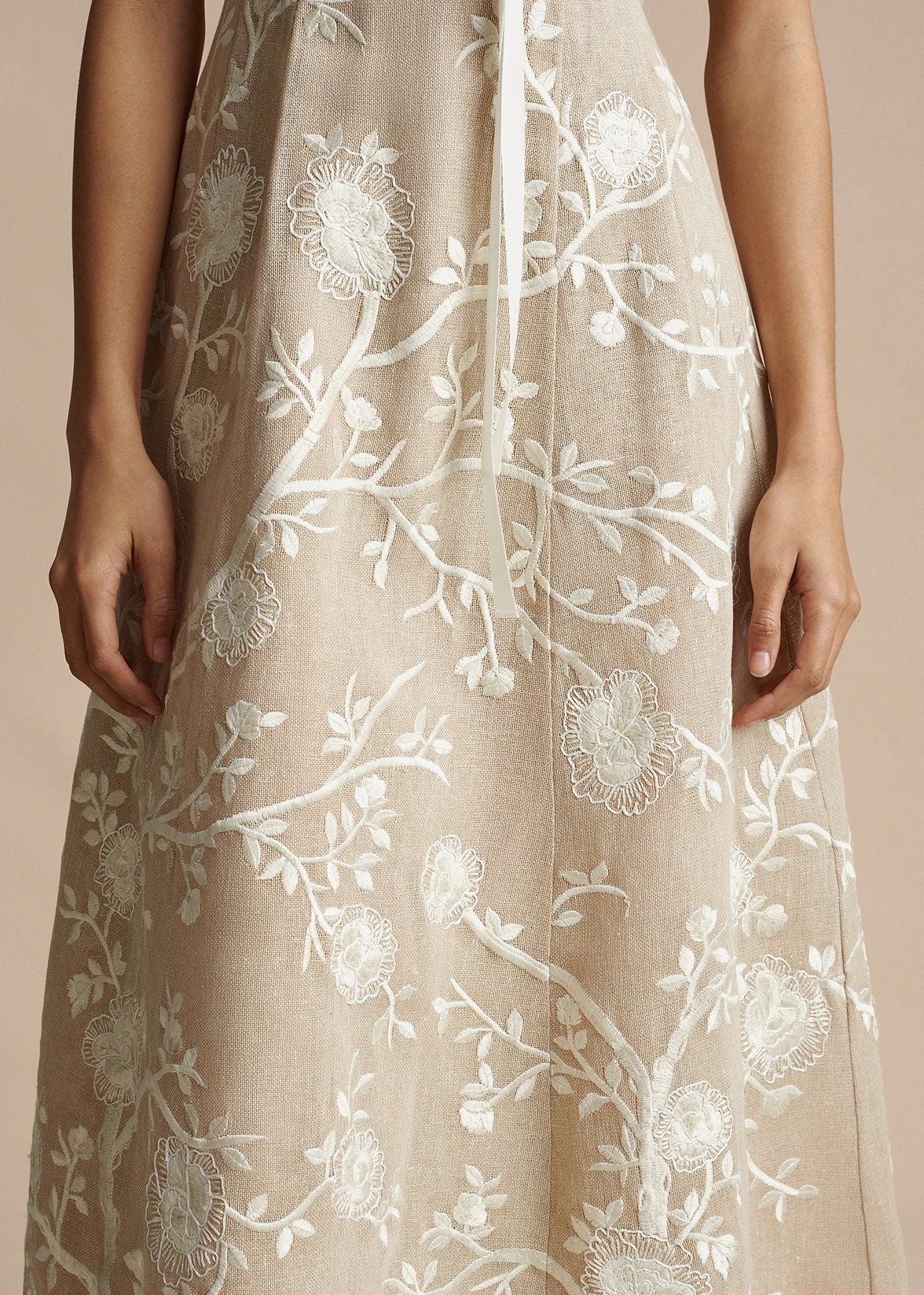 A close up image of the hand embroidered design on the Embroidered Eloise Dress in Cotton Burlap by Adam Lippes