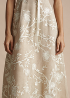 A close up image of the hand embroidered design on the Embroidered Eloise Dress in Cotton Burlap.