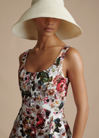 Close up of model wearing the Cleo Hat in Ivory and the Amelie Dress in Printed Cotton Twill.