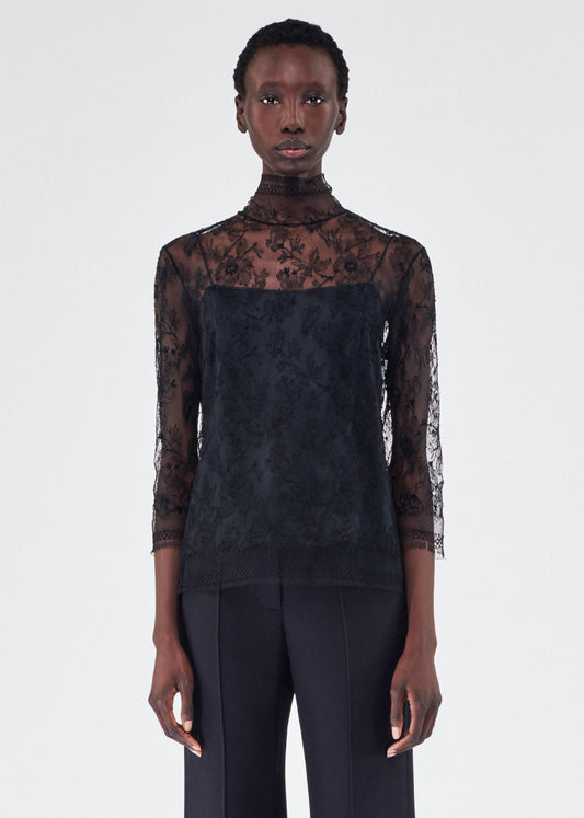 model wearing the adam lippes chantilly lace turtleneck in black