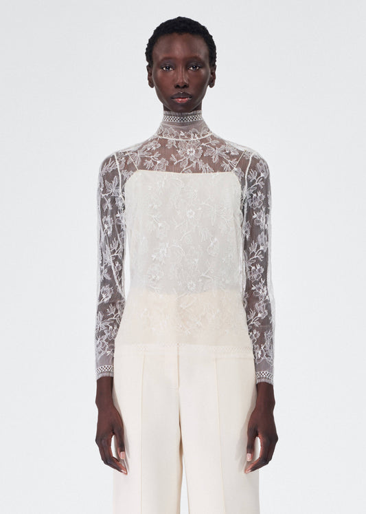 model wearing the adam lippes chantilly lace turtleneck