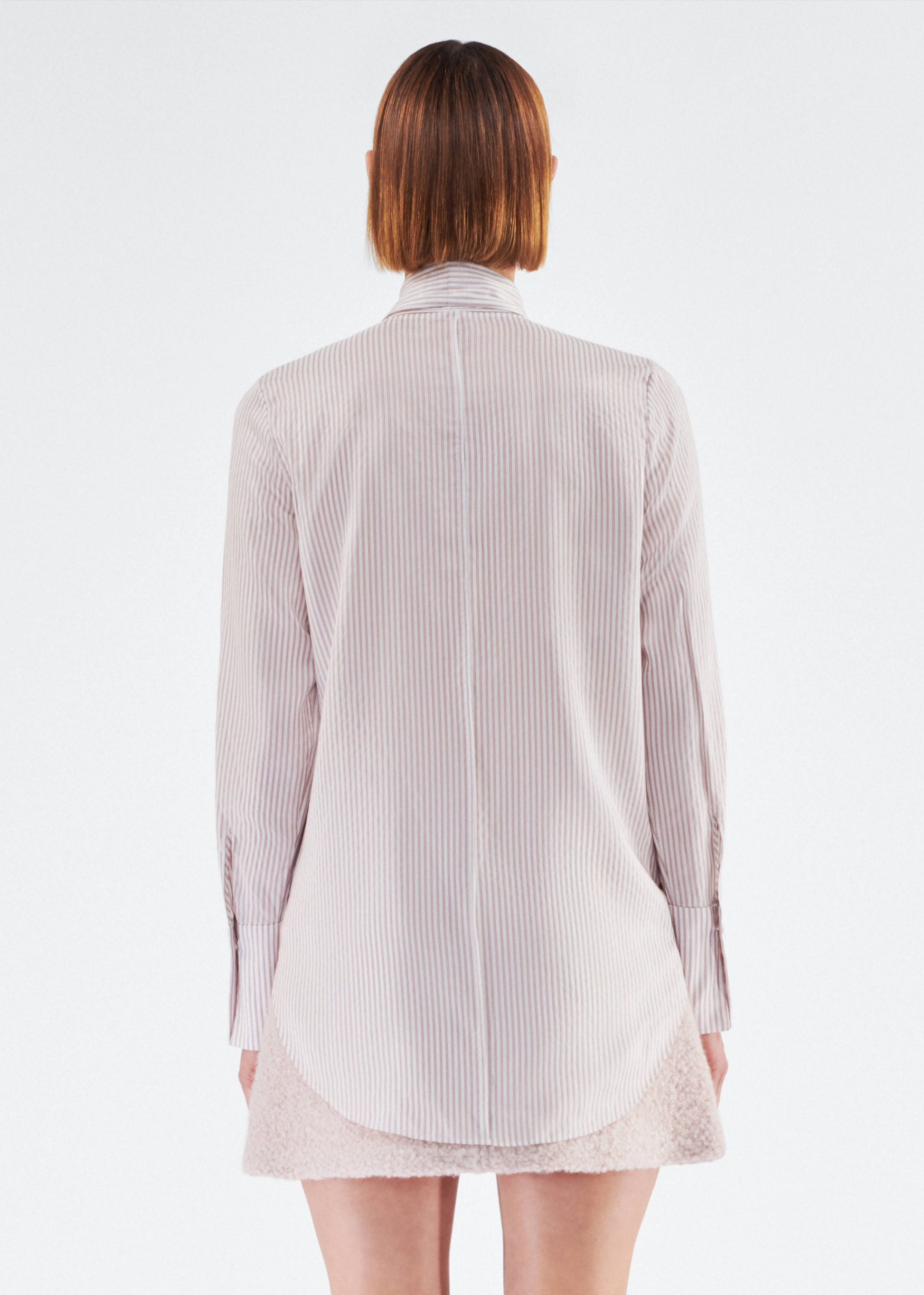 Back of model wearing the Lee Blouse in Silk Stripe in Blush/Ivory