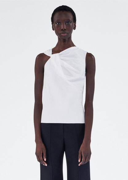 model wearing feyda top by adam lippes in compact cotton poplin in white