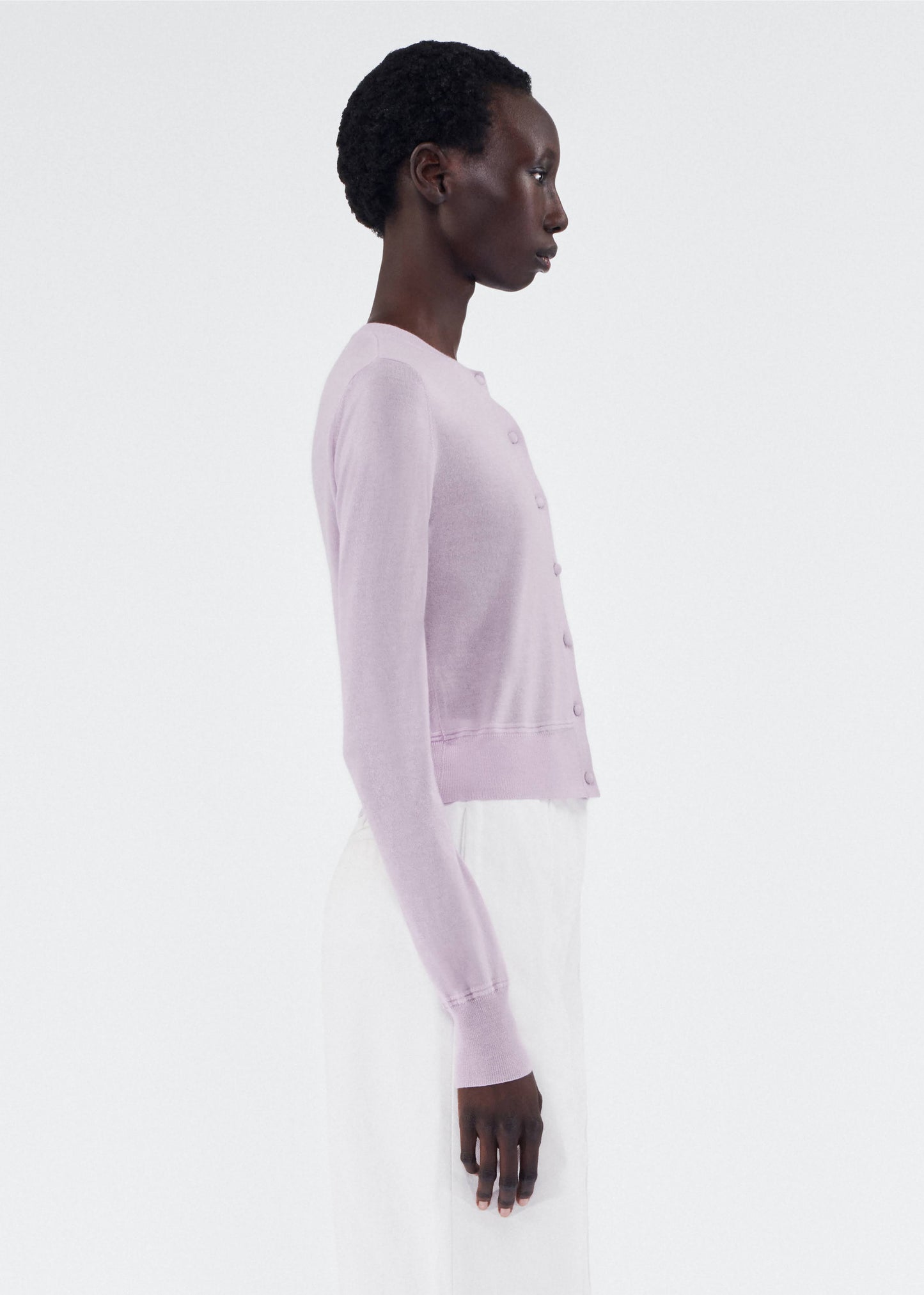 side view of model wearing the adam lippes caridgan in cashmere silk in lilac