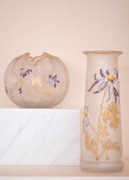 A tall Mont Joye glass vase with gold and purple enameling. Featured with a short, round Mont Joye vase with purple and gold enameling. 
