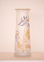 A tall Mont Joye glass vase with gold and purple enameling. 