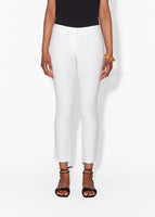 Cropped image of a model wearing a white cigarette pant.