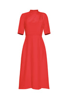 A flat lay of a red draped neck dress. 