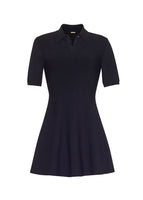 A flat lay of black polo mini dress. 