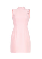 A flat lay of a pale pink sheath dress. 