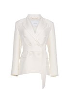 A flat lay of  an ivory double breasted silk wool jacket