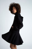A side view of a black hooded zip up dress.