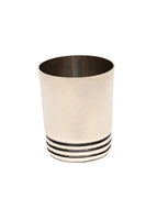 An image of a sterling silver cup with ridging at the base. 