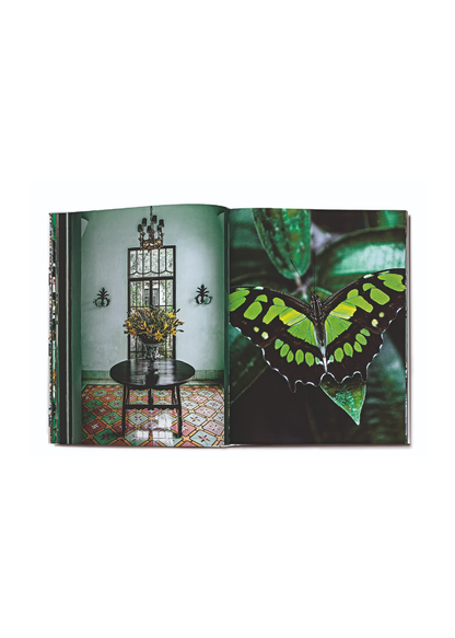 An image of Carlos Mota's "Forever Green" open to a page showcasing green interiors. 